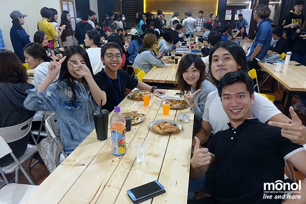 students-enjoying-pizza-dining-hall-party